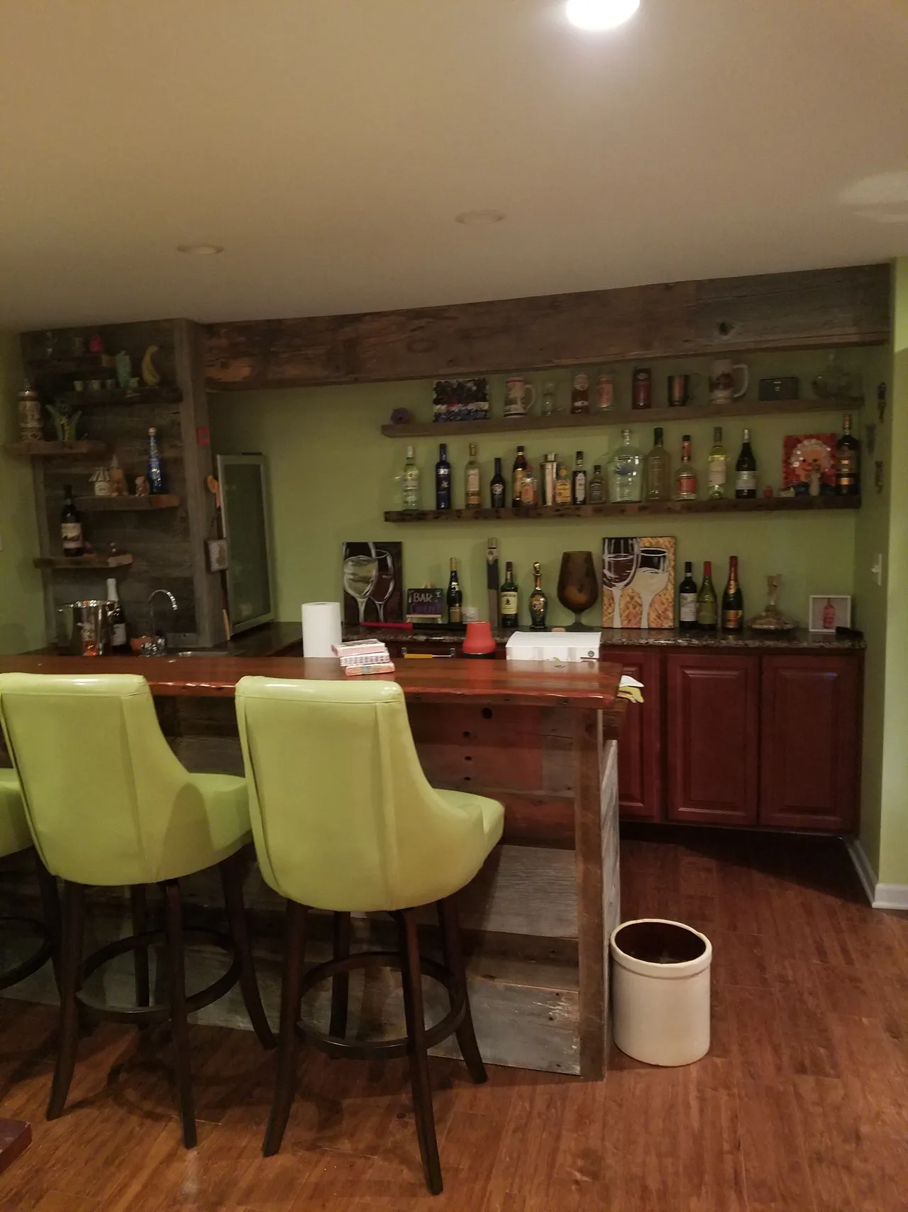 custom barnwood style bar designed in this basement remodel by general contractor