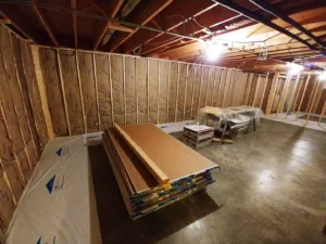 A room that is being remodeled with wood and drywall.