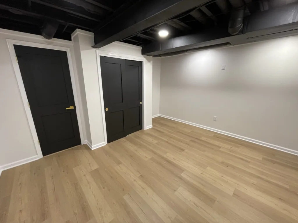 An empty room with wood floors.