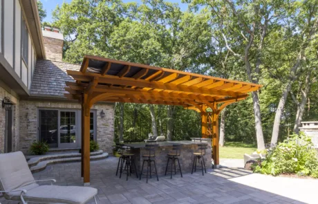 A pergola-enhanced outdoor kitchen perfect for a home renovation project.