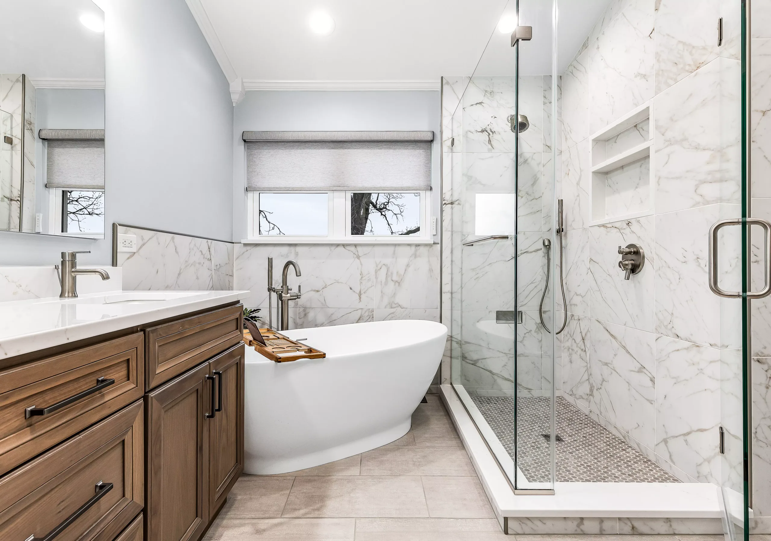 A bathroom with a tub, shower, and sink perfect for a bathroom remodel.