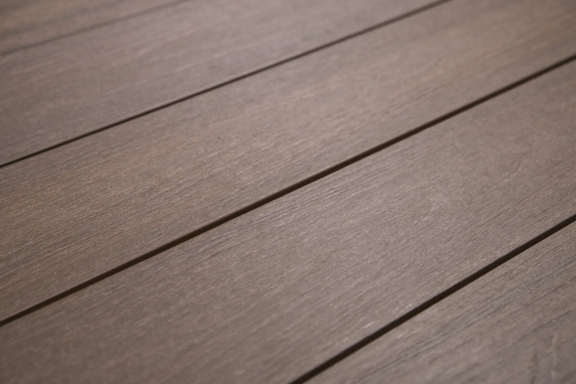 Close-up of textured brown decking boards arranged horizontally.